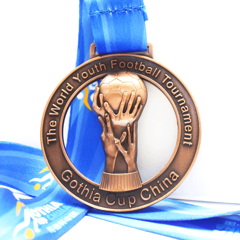 Zinc Alloy Die Casted Polished World Youth Football Theme 3D Trophy-Shaped Hollow Gold Medal with Blue Lanyard